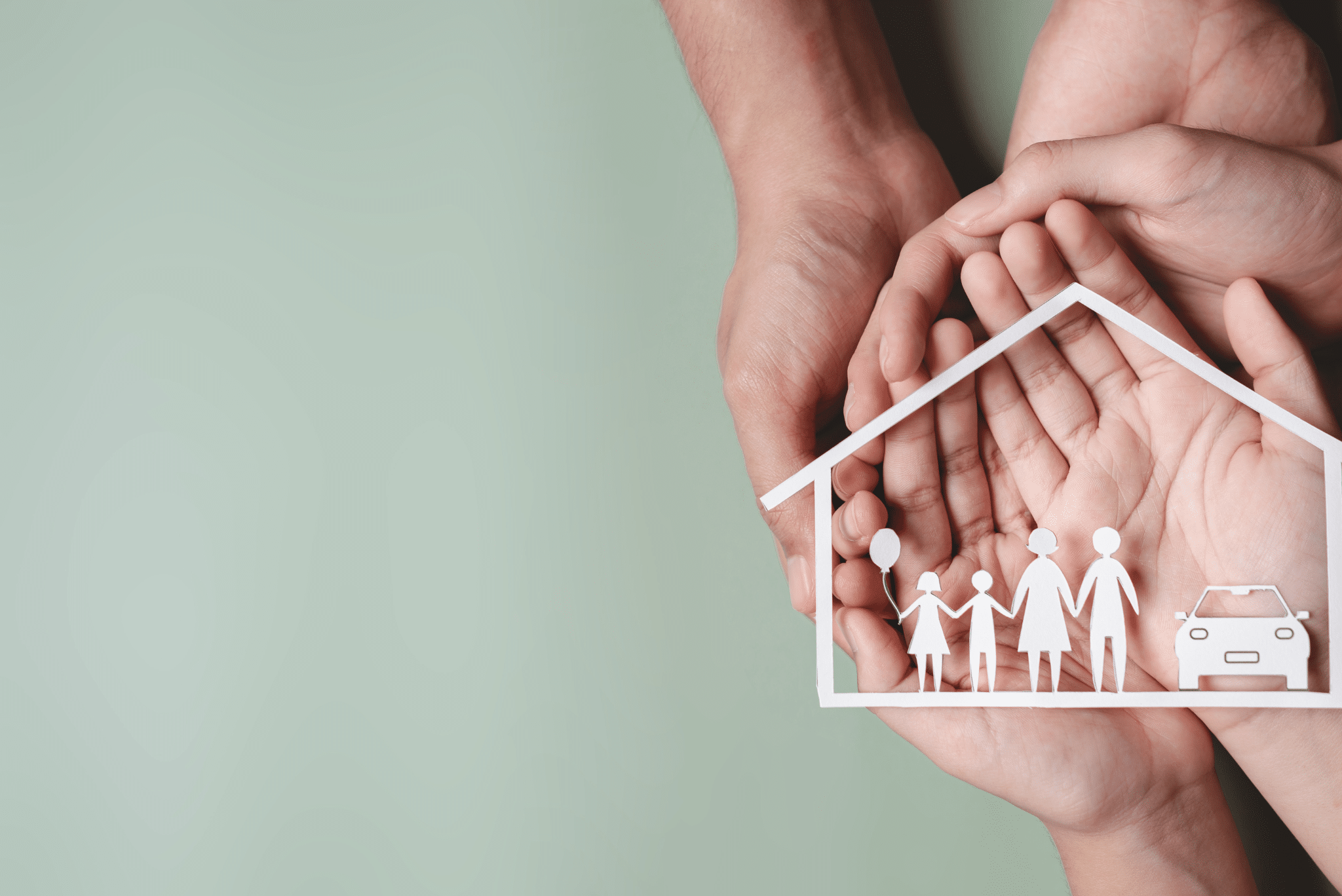 Hands holding a paper cutout of a house and family over a soft green background, symbolizing home safety and insurance. Hands holding a paper cutout of a house and family over a soft green background, symbolizing home safety and insurance.